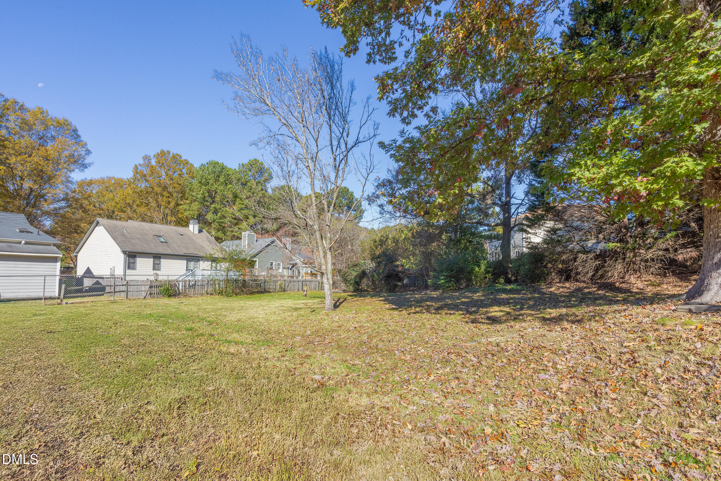 5520 Round Hill Lane Raleigh, NC 27616 - Photo 27 of 29 a view of a yard with a house and large tree