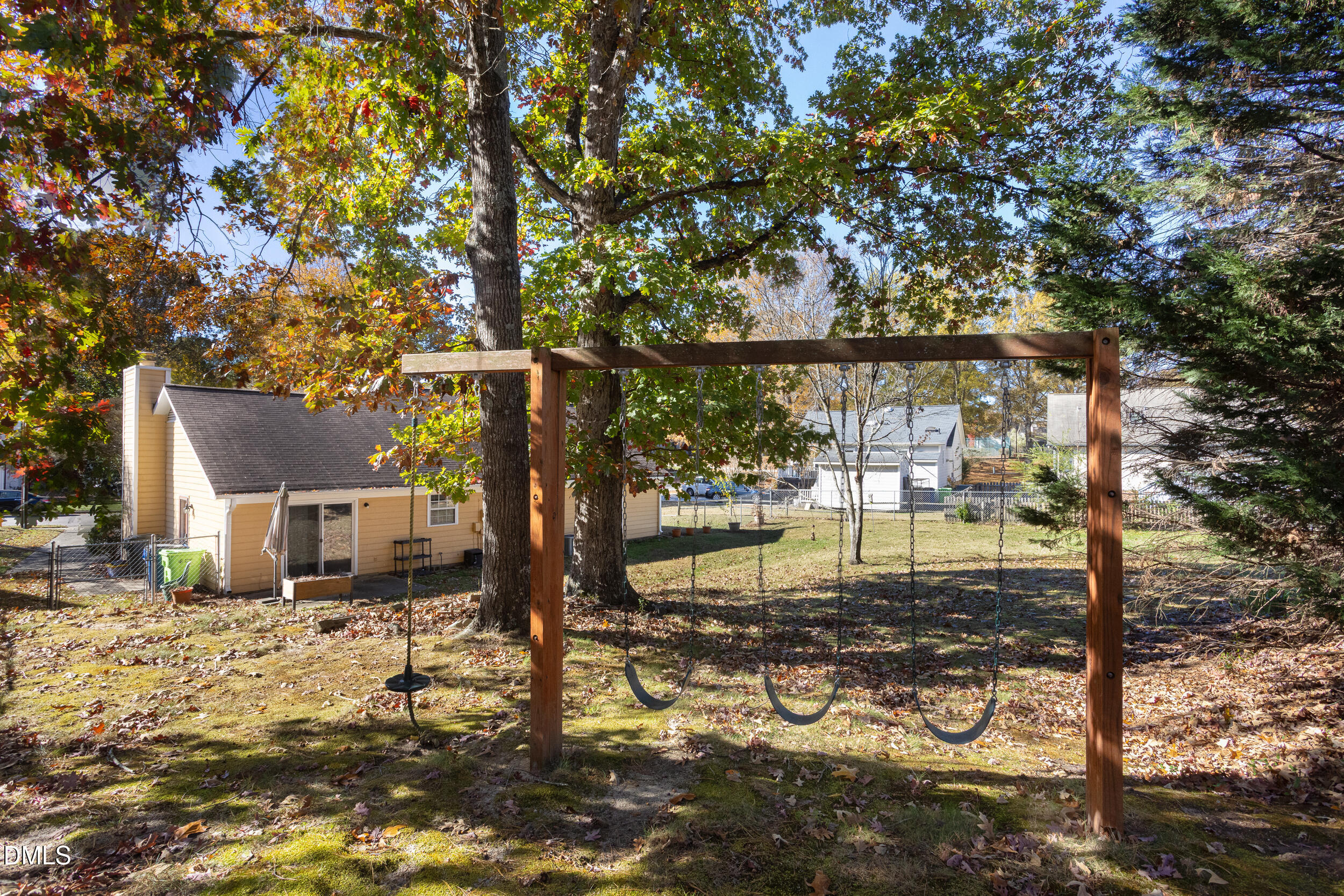 5520 Round Hill Lane Raleigh, NC 27616 - Photo 29 of 29 a backyard of a house with lots of green space