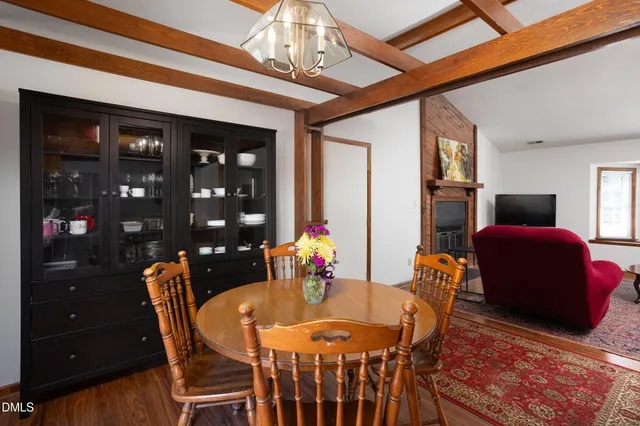 a dining room with furniture and chandelier
