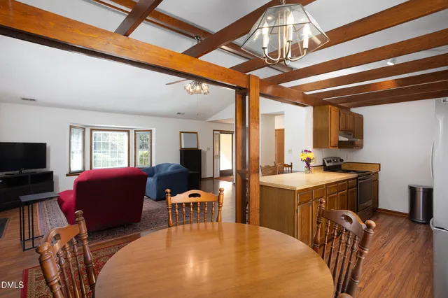 a view of a livingroom with furniture and a window