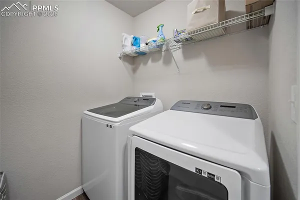 a utility room with dryer and washer