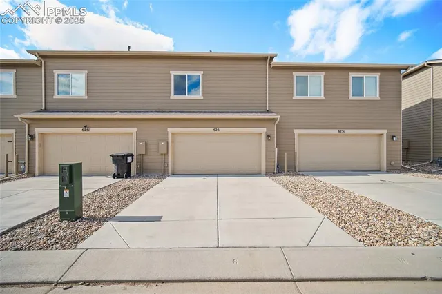a front view of a house with a garage