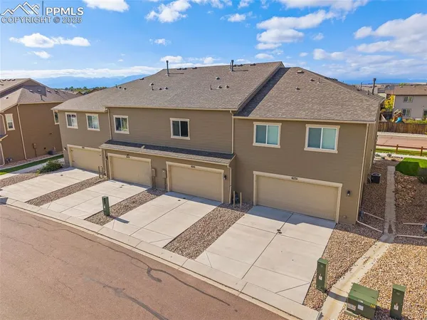 a terrace of a house with outdoor seating
