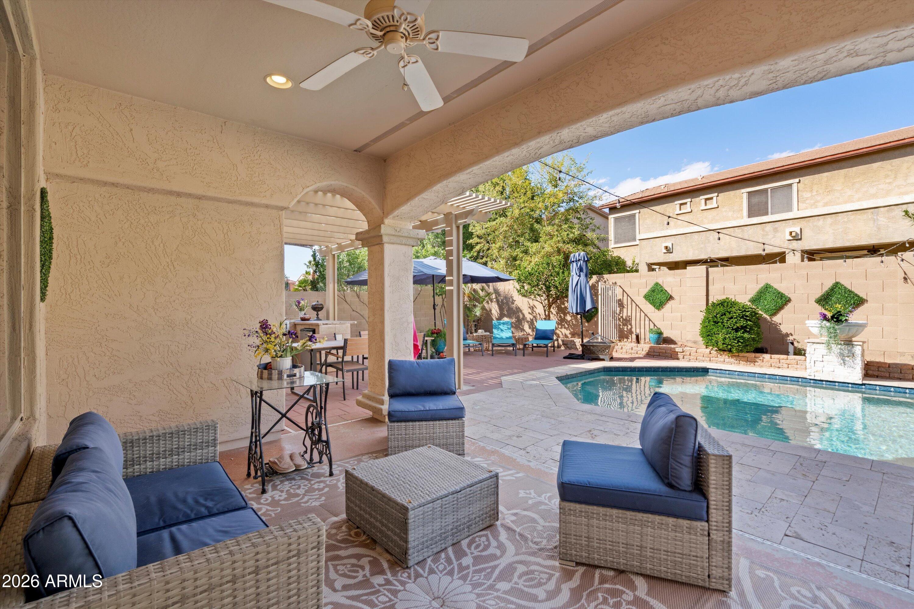 16018 West Shangri La Road Surprise, AZ 85379 - Photo 13 of 40 a living room with furniture and a large window
