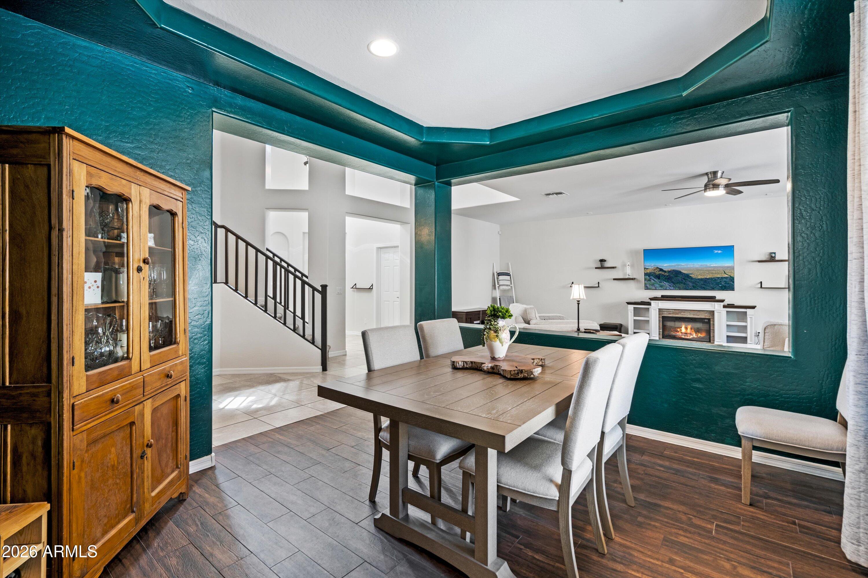 16018 West Shangri La Road Surprise, AZ 85379 - Photo 19 of 40 a view of a dining room with furniture window and wooden floor