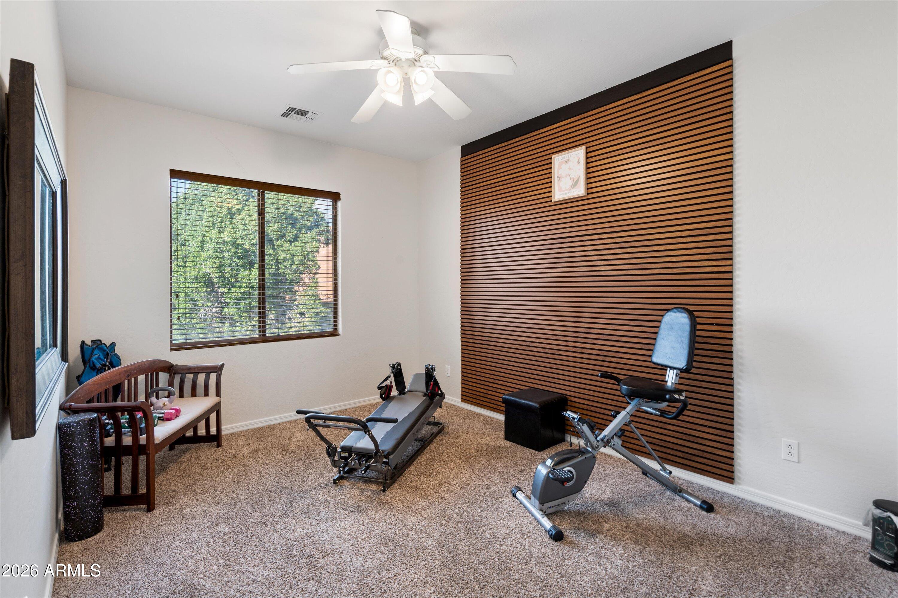 16018 West Shangri La Road Surprise, AZ 85379 - Photo 33 of 40 a view of a workspace with furniture and a window