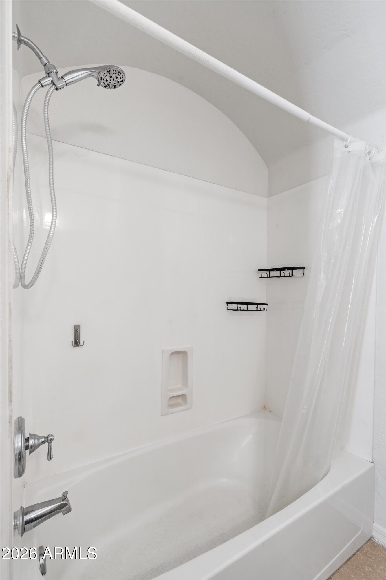 16018 West Shangri La Road Surprise, AZ 85379 - Photo 35 of 40 a bathroom with a shower and a bath tub