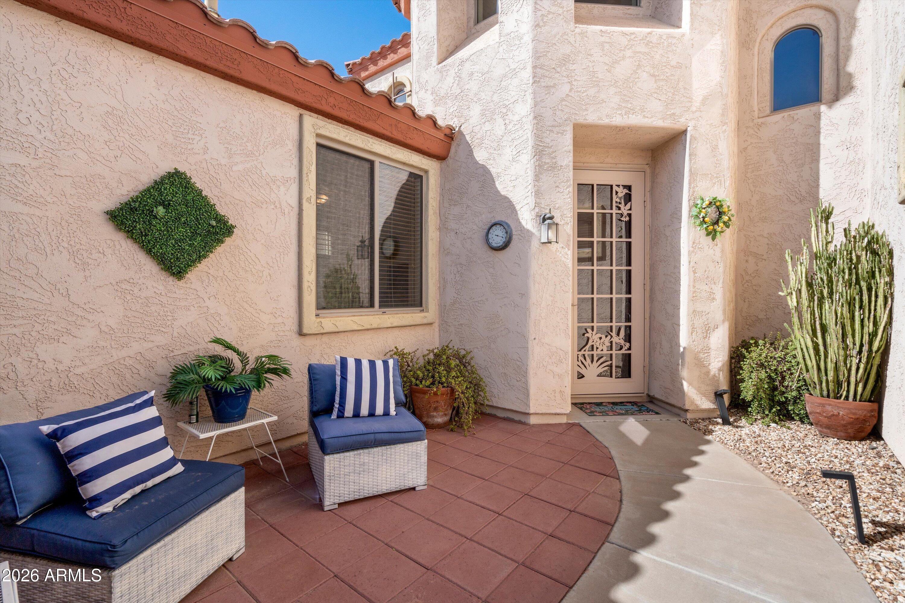 16018 West Shangri La Road Surprise, AZ 85379 - Photo 5 of 40 a building outdoor space with patio couch