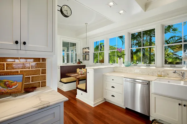 a kitchen with stainless steel appliances granite countertop a stove and a sink