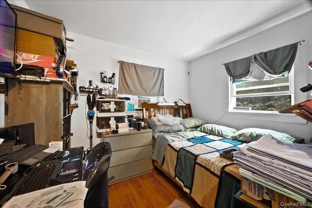 a bed room with a bed and a window