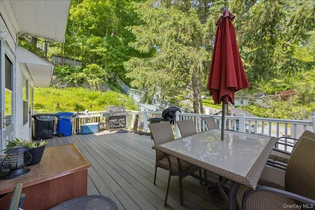 a view of a dining table and chairs in the patio