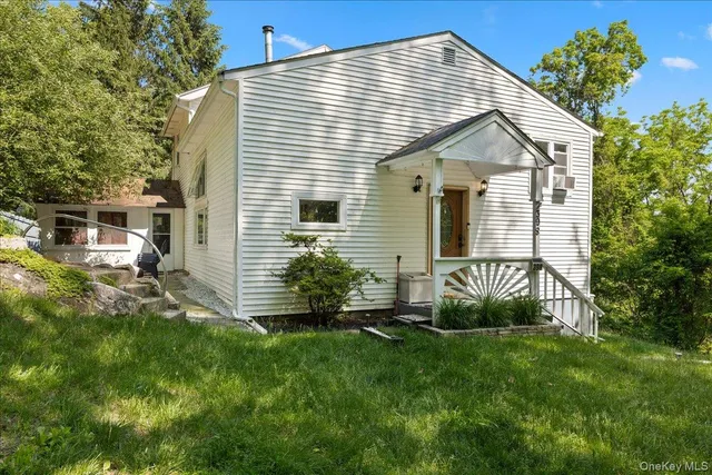 a view of backyard with a garden and plants