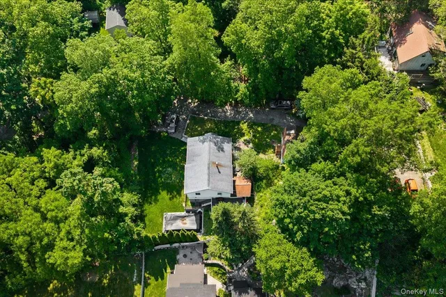 an aerial view of a house with a yard and garden