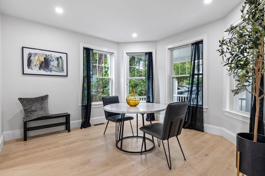 31 Rodman Street, Unit 2 Boston, MA 02130 - Photo 12 of 40 a work room with furniture and large windows