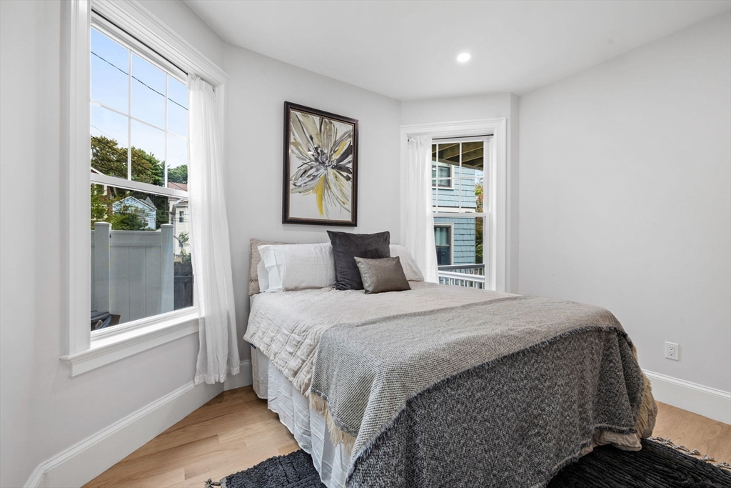 31 Rodman Street, Unit 2 Boston, MA 02130 - Photo 14 of 40 a bedroom with a bed and a window