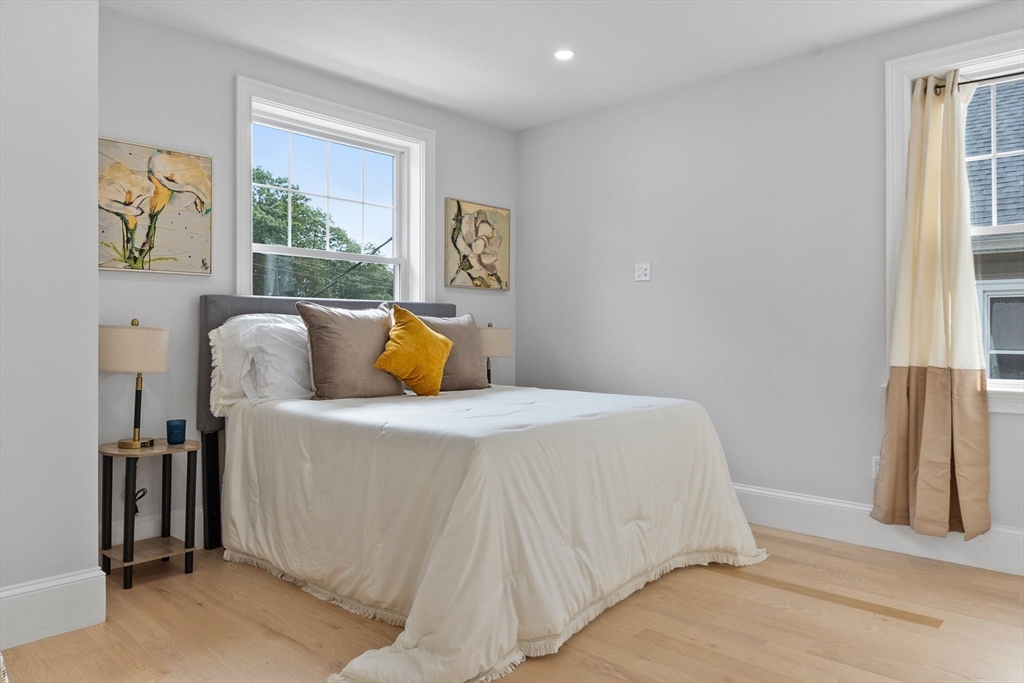 31 Rodman Street, Unit 2 Boston, MA 02130 - Photo 18 of 40 a bedroom with a bed and a window