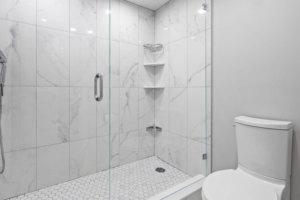 31 Rodman Street, Unit 2 Boston, MA 02130 - Photo 20 of 40 a bathroom with a shower and toilet