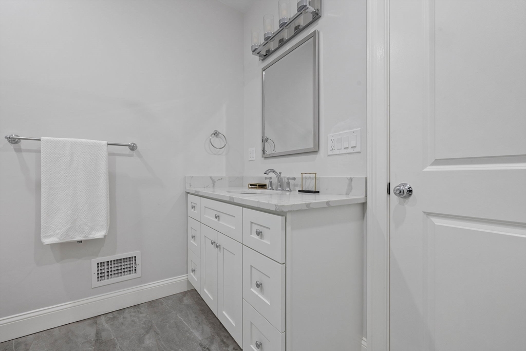 31 Rodman Street, Unit 2 Boston, MA 02130 - Photo 23 of 40 a bathroom with a sink and a mirror