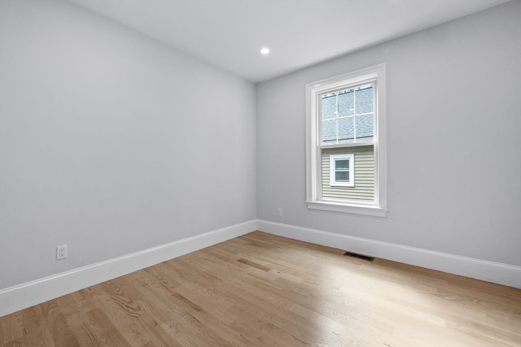 31 Rodman Street, Unit 2 Boston, MA 02130 - Photo 25 of 40 an empty room with a window