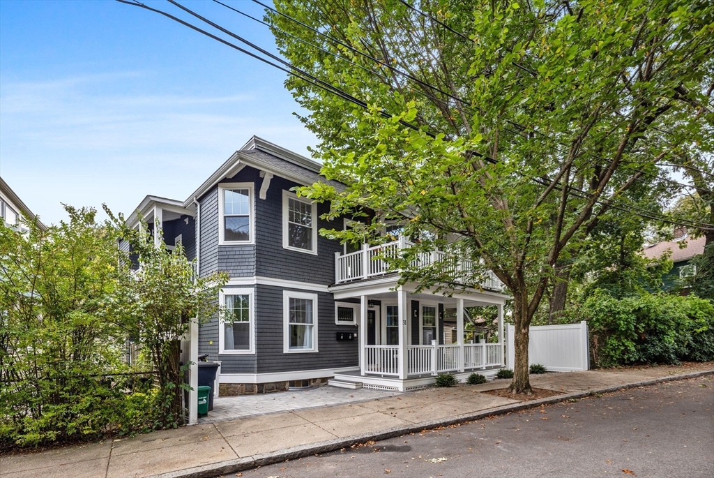 31 Rodman Street, Unit 2 Boston, MA 02130 - Photo 28 of 40 a front view of a house with a garden
