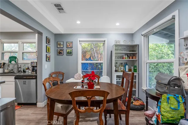 a view of a dining room with furniture window and outside view