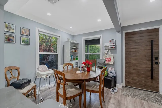 a dining room with furniture and window