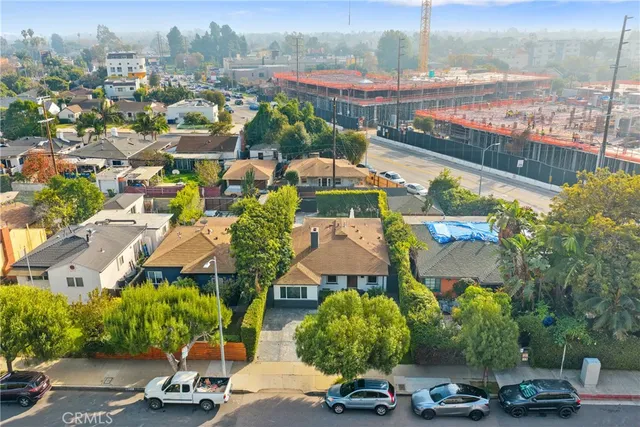 an aerial view of multiple houses with yard