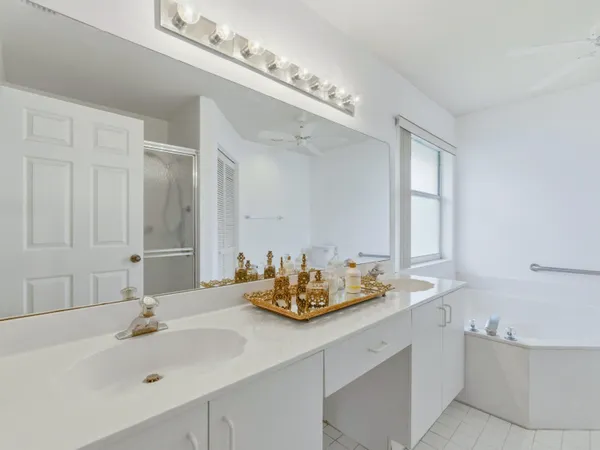 a bathroom with a sink double vanity and a mirror