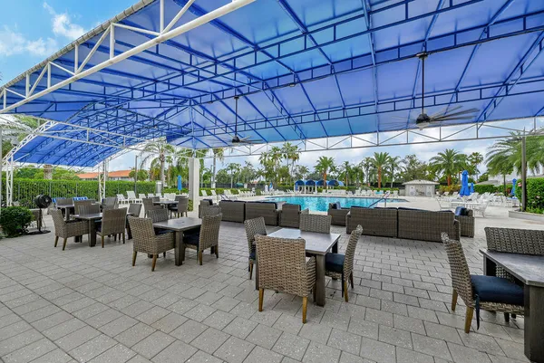 a sign broad in front of a tree