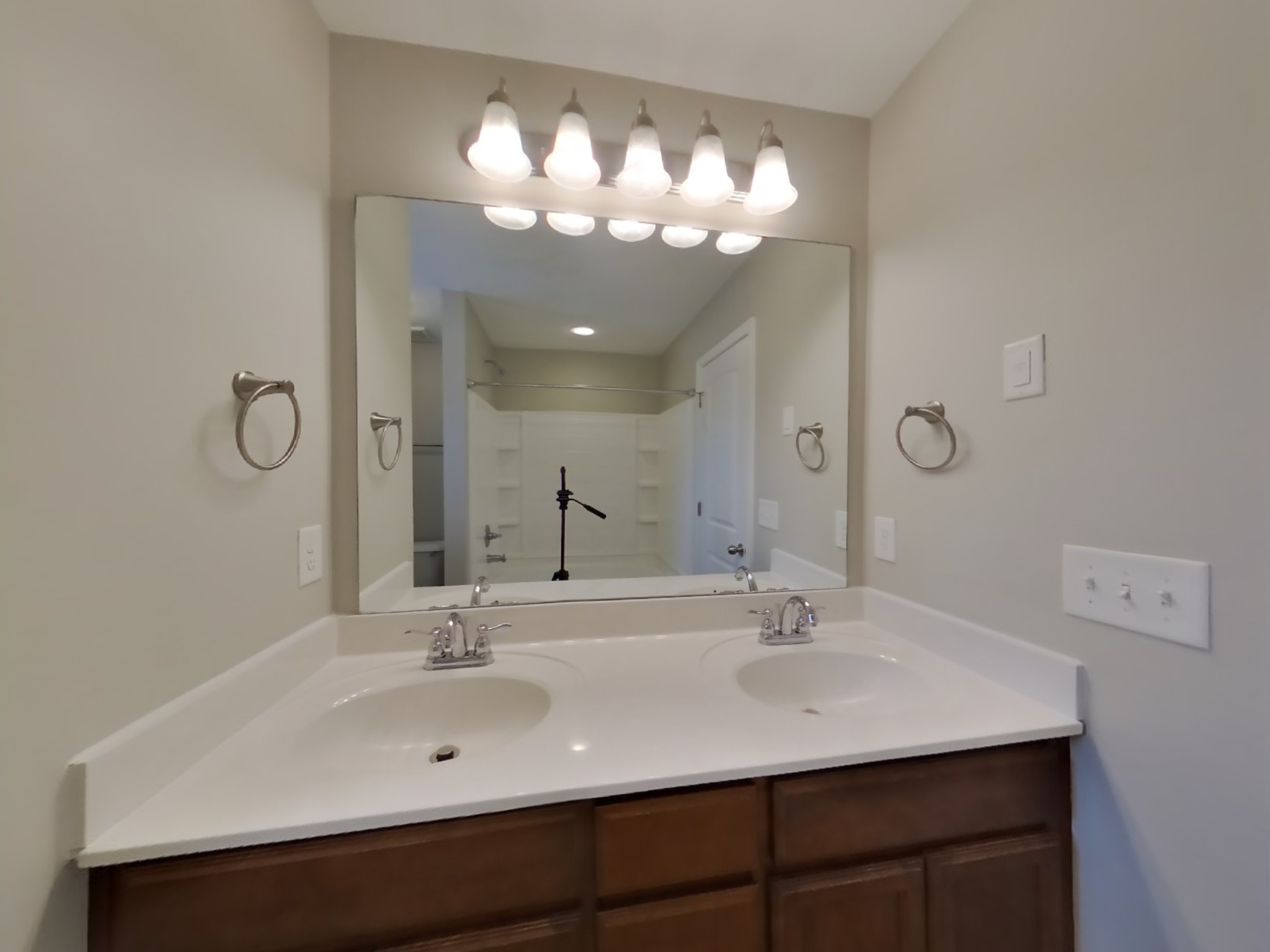 7100 Colquitt Way Fairview, TN 37062 - Photo 9 of 15 a bathroom with a sink vanity and a mirror