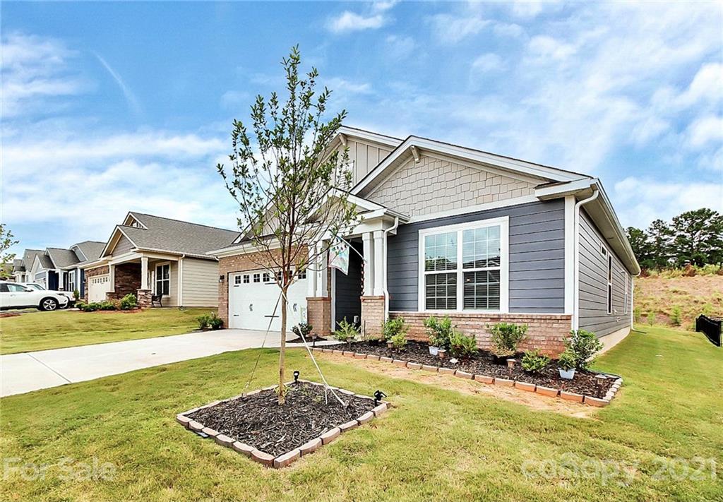 7131 Chrysanthemum Road Lancaster, SC 29720 - Photo 2 of 33 a front view of a house with a yard outdoor seating and yard