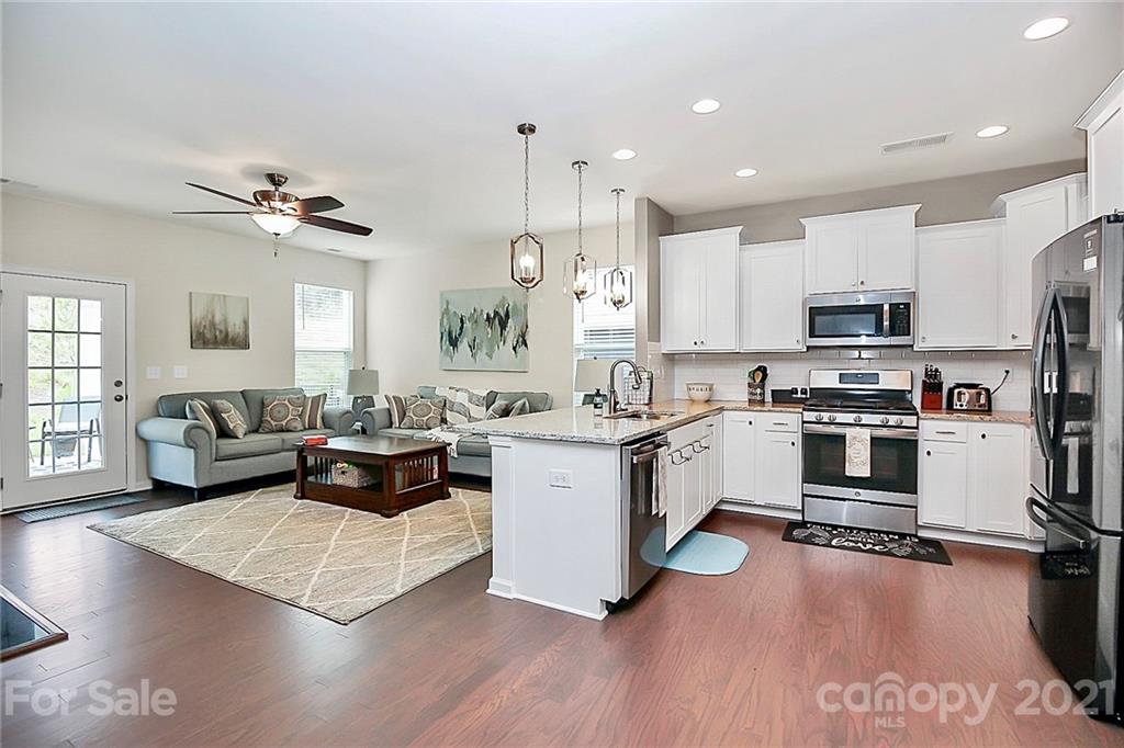 7131 Chrysanthemum Road Lancaster, SC 29720 - Photo 11 of 33 a large kitchen with a large window a counter space a sink stainless steel appliances and cabinets