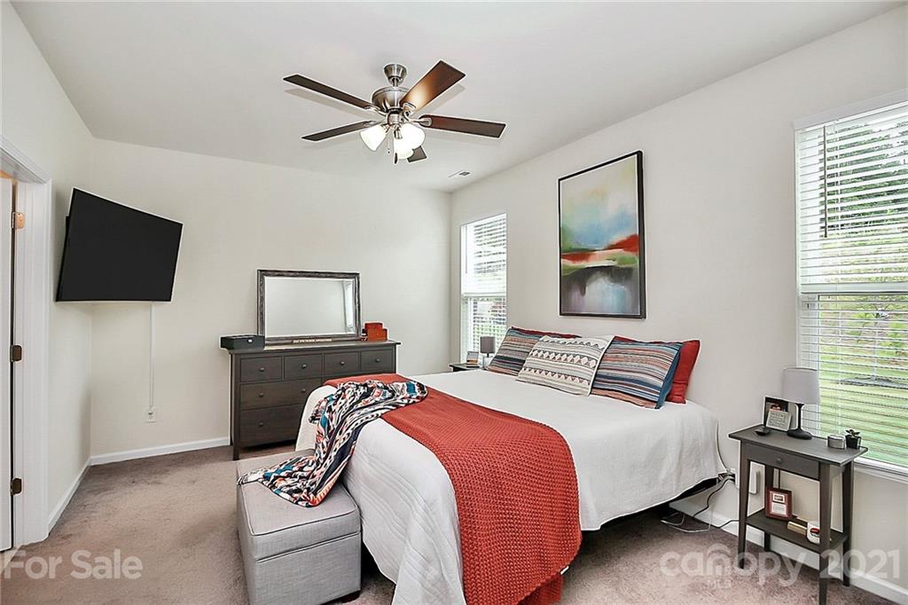 7131 Chrysanthemum Road Lancaster, SC 29720 - Photo 15 of 33 a bedroom with a bed and a flat screen tv