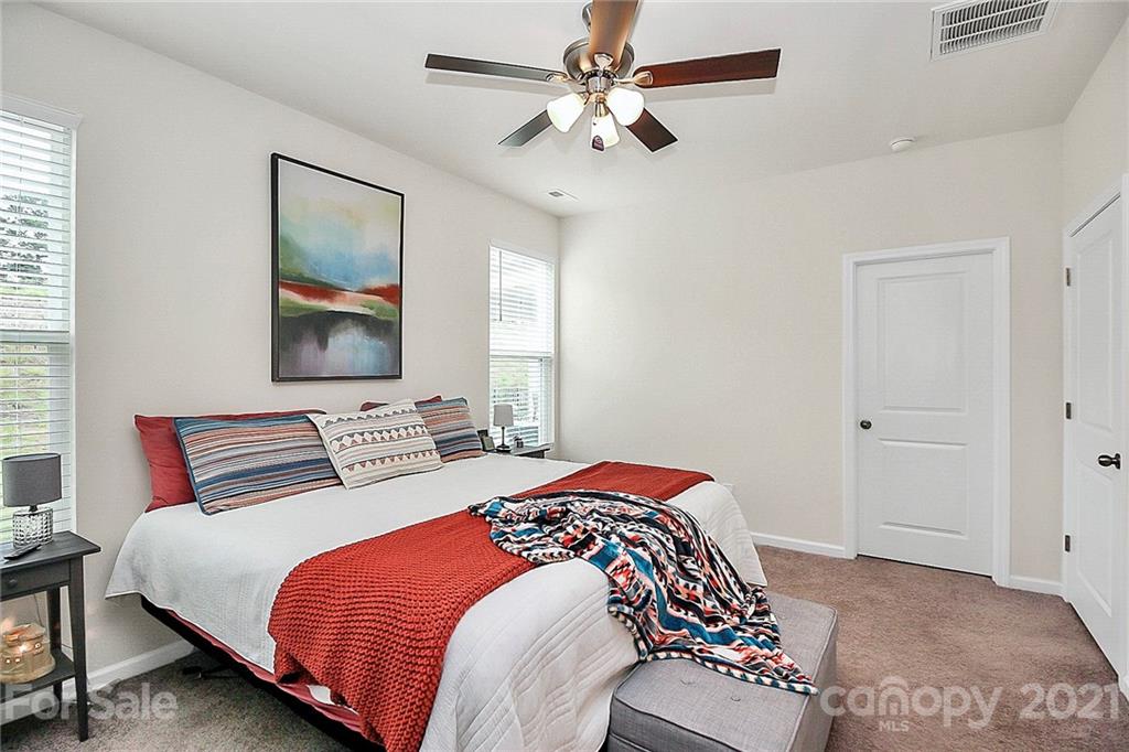 7131 Chrysanthemum Road Lancaster, SC 29720 - Photo 16 of 33 a bedroom with a bed and a painting on the wall