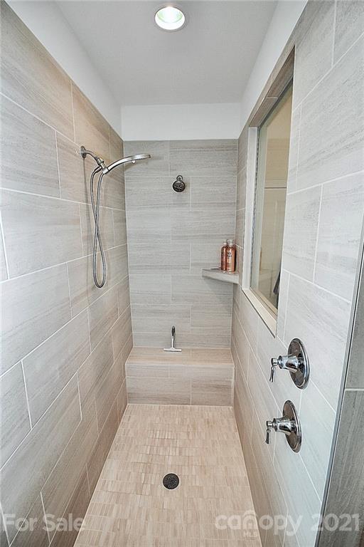 7131 Chrysanthemum Road Lancaster, SC 29720 - Photo 18 of 33 a bathroom with a bathtub and shower