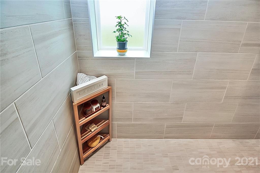 7131 Chrysanthemum Road Lancaster, SC 29720 - Photo 20 of 33 a bathroom with a window and a shower