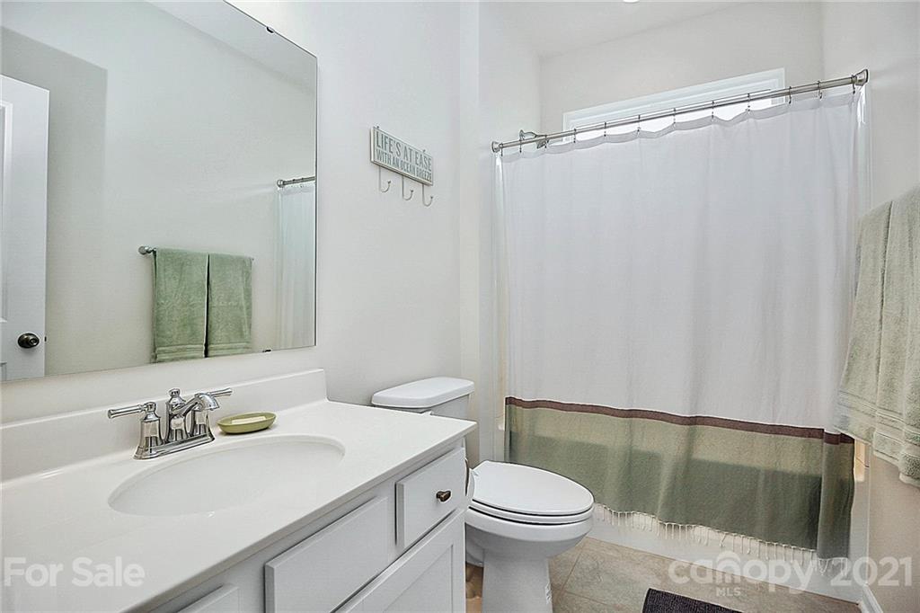 7131 Chrysanthemum Road Lancaster, SC 29720 - Photo 25 of 33 a bathroom with a sink toilet and shower