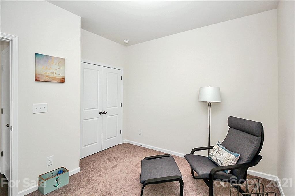 7131 Chrysanthemum Road Lancaster, SC 29720 - Photo 27 of 33 a view of a workspace with furniture and a lamp