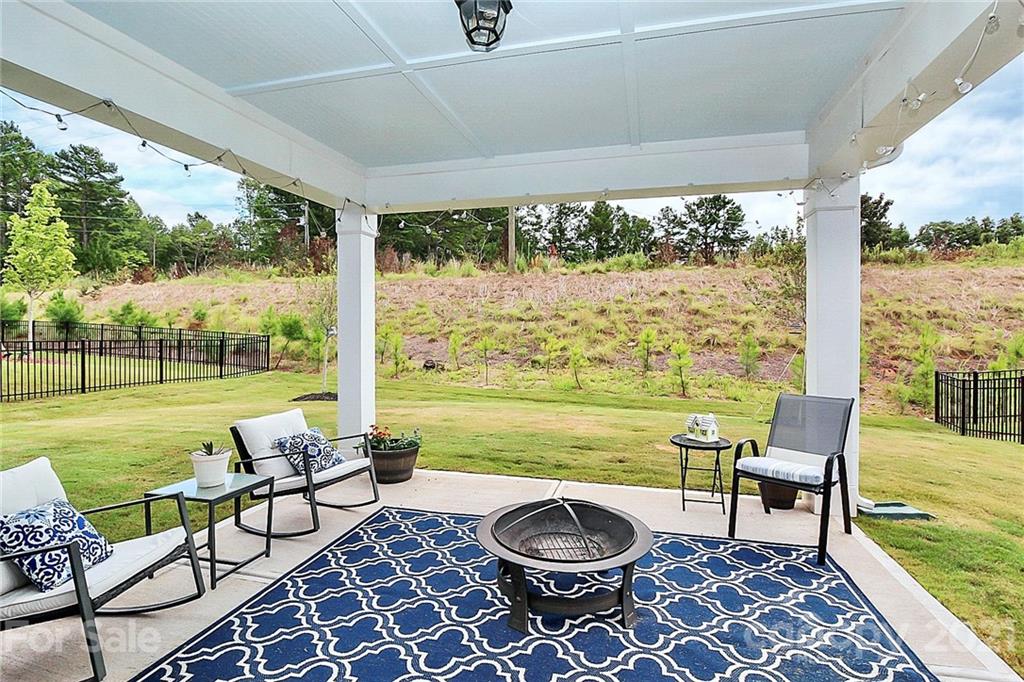7131 Chrysanthemum Road Lancaster, SC 29720 - Photo 4 of 33 a view of a porch with furniture and garden