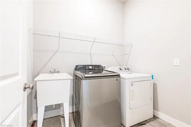 a utility room with dryer and washer