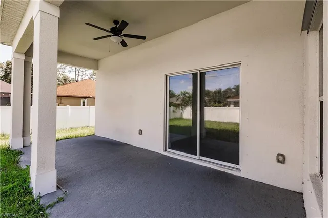 a view of a livingroom with a ceiling fan and window