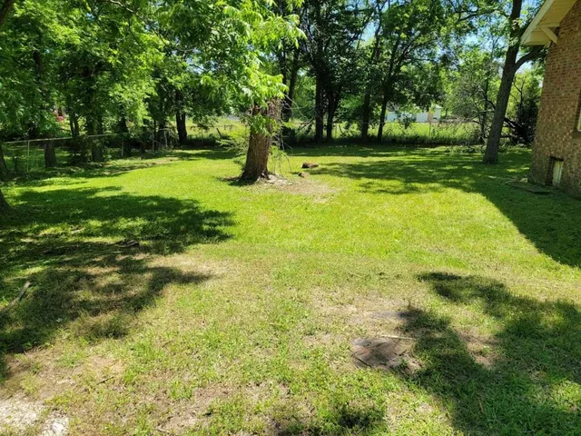 a view of backyard with green space