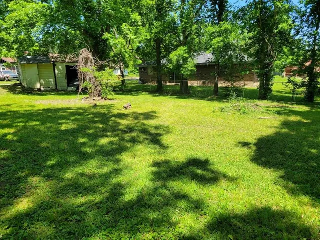 a view of a backyard with a garden
