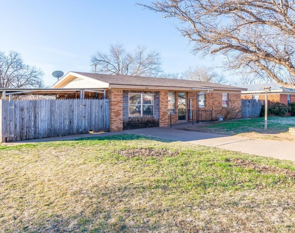 1216 10th Street Shallowater, TX 79363 - Photo 1 of 20 front view of a house with a yard