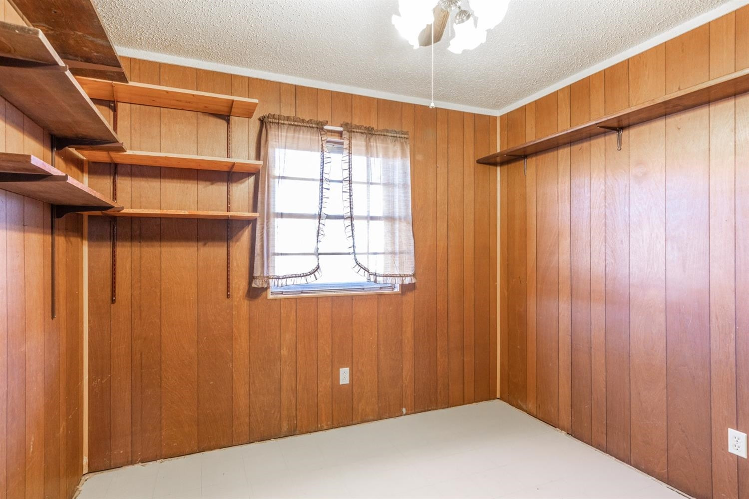 1216 10th Street Shallowater, TX 79363 - Photo 9 of 20 a view of a room with a wooden door
