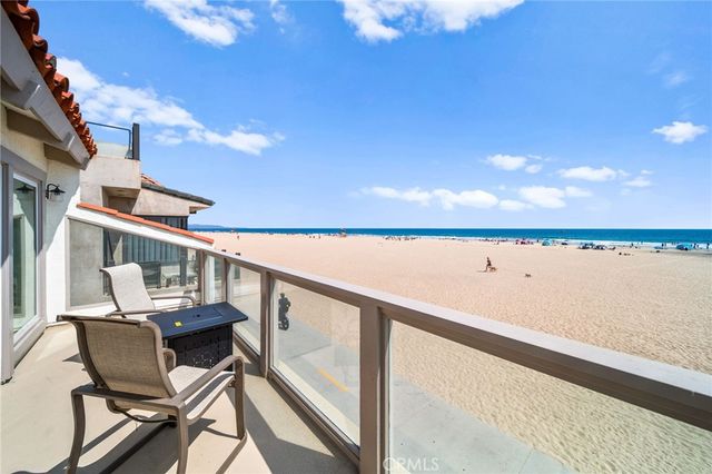 a view of balcony with wooden floor and outdoor seating