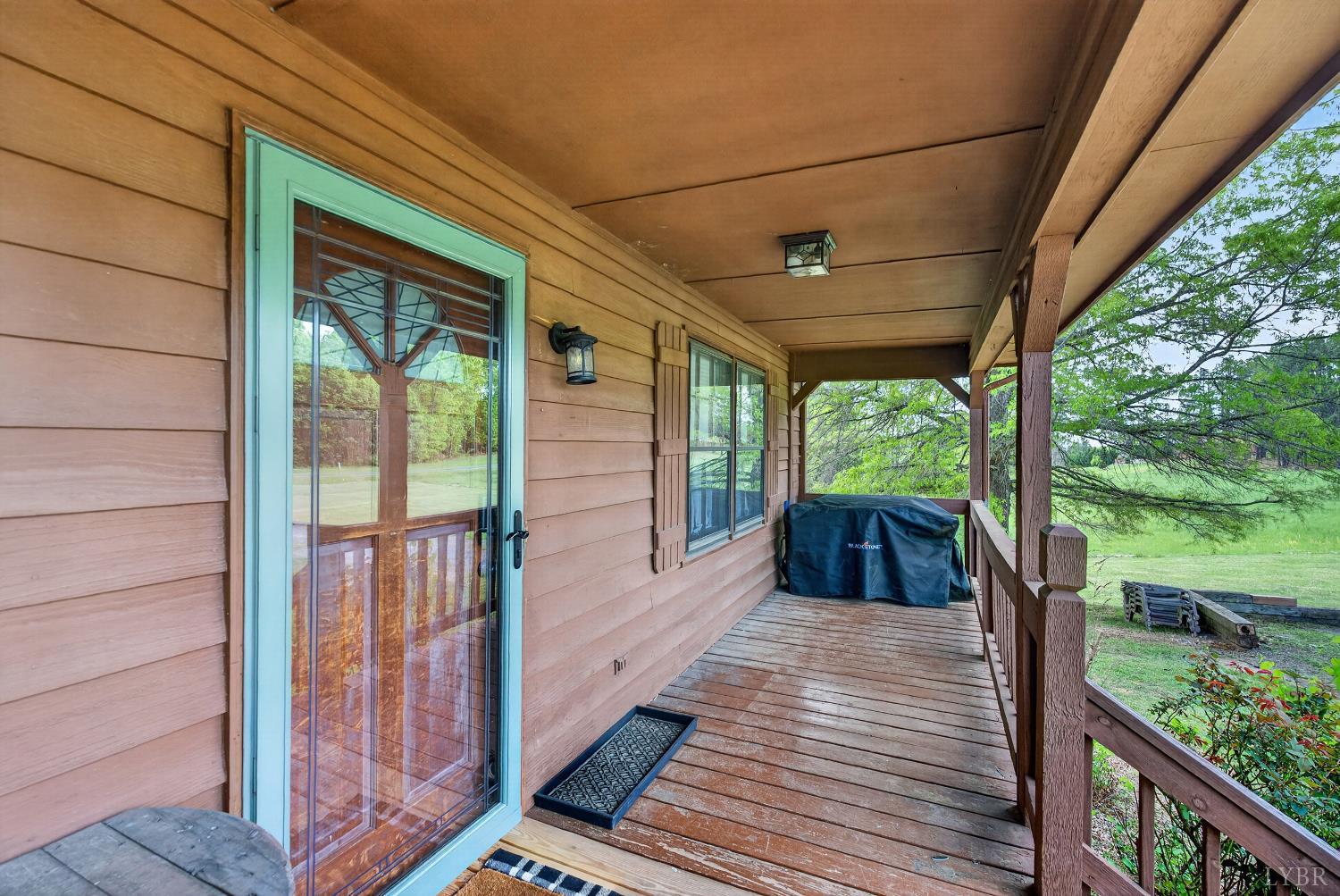 1002 Homeplace Road Rustburg, VA 24588 - Photo 2 of 48 a view of a porch with wooden floor and outdoor space