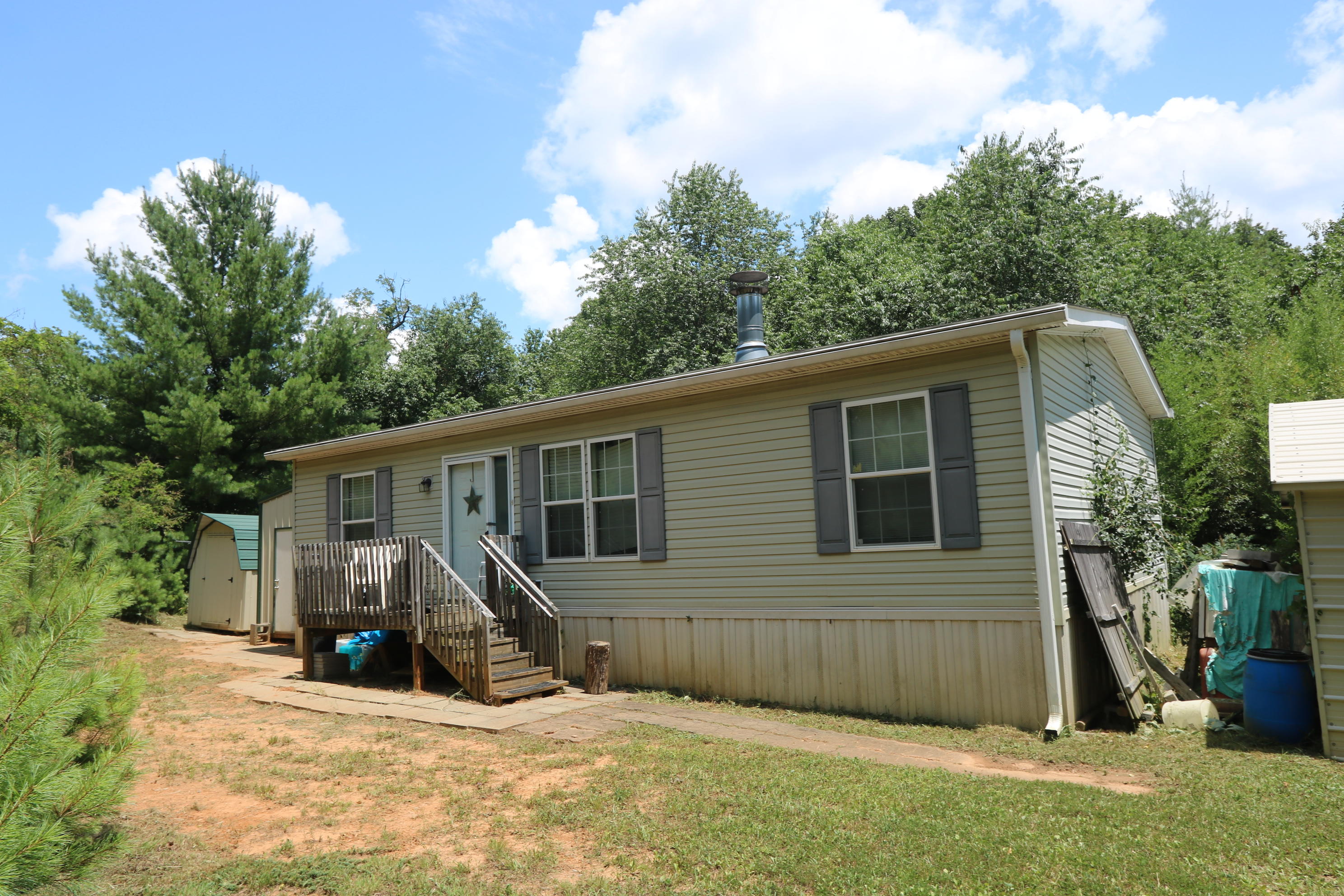 127 Millimeter Road Southwest Floyd, VA 24091 - Photo 1 of 31 a view of a house with a yard and large tree