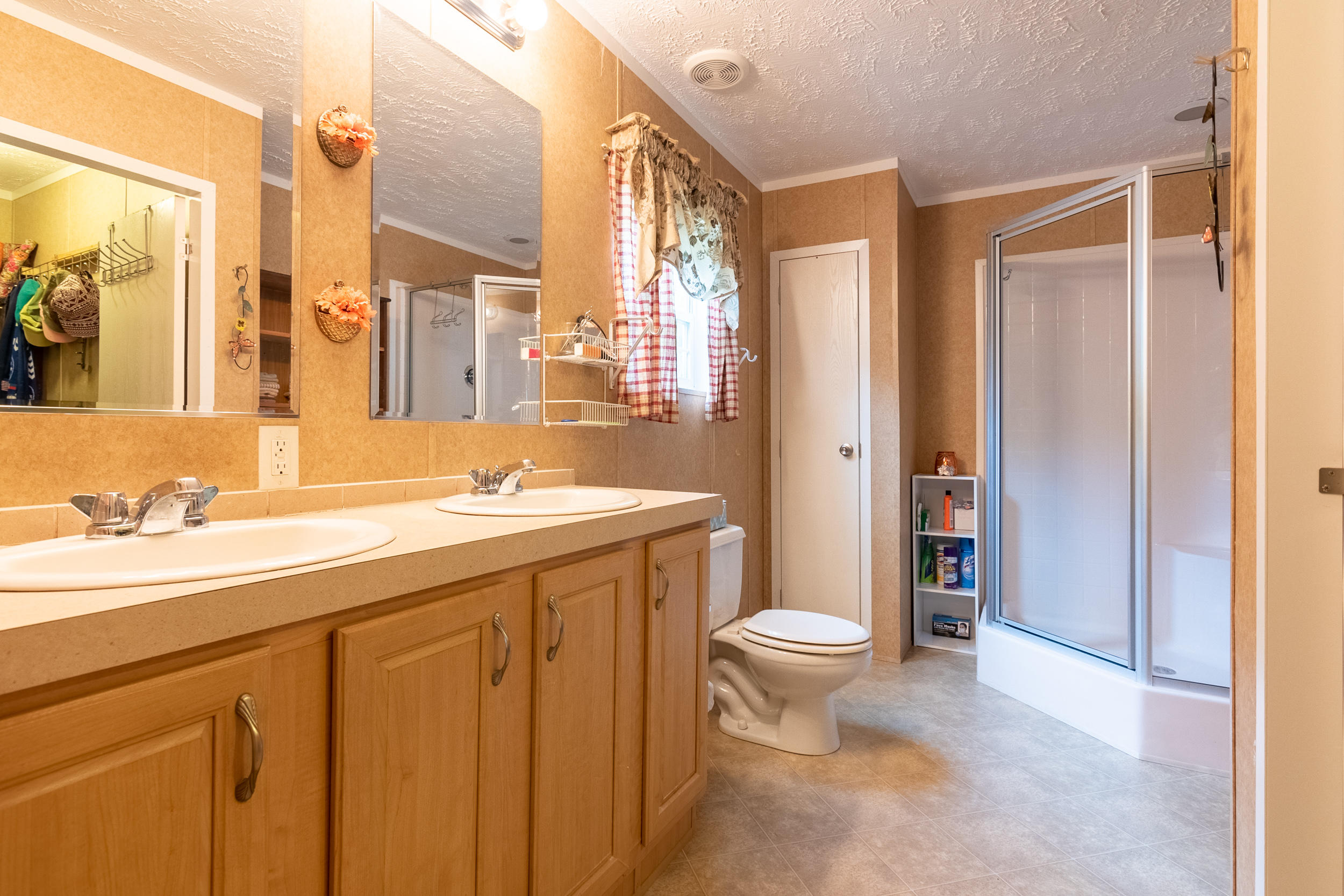 127 Millimeter Road Southwest Floyd, VA 24091 - Photo 2 of 31 a spacious bathroom with a granite countertop sink toilet and shower