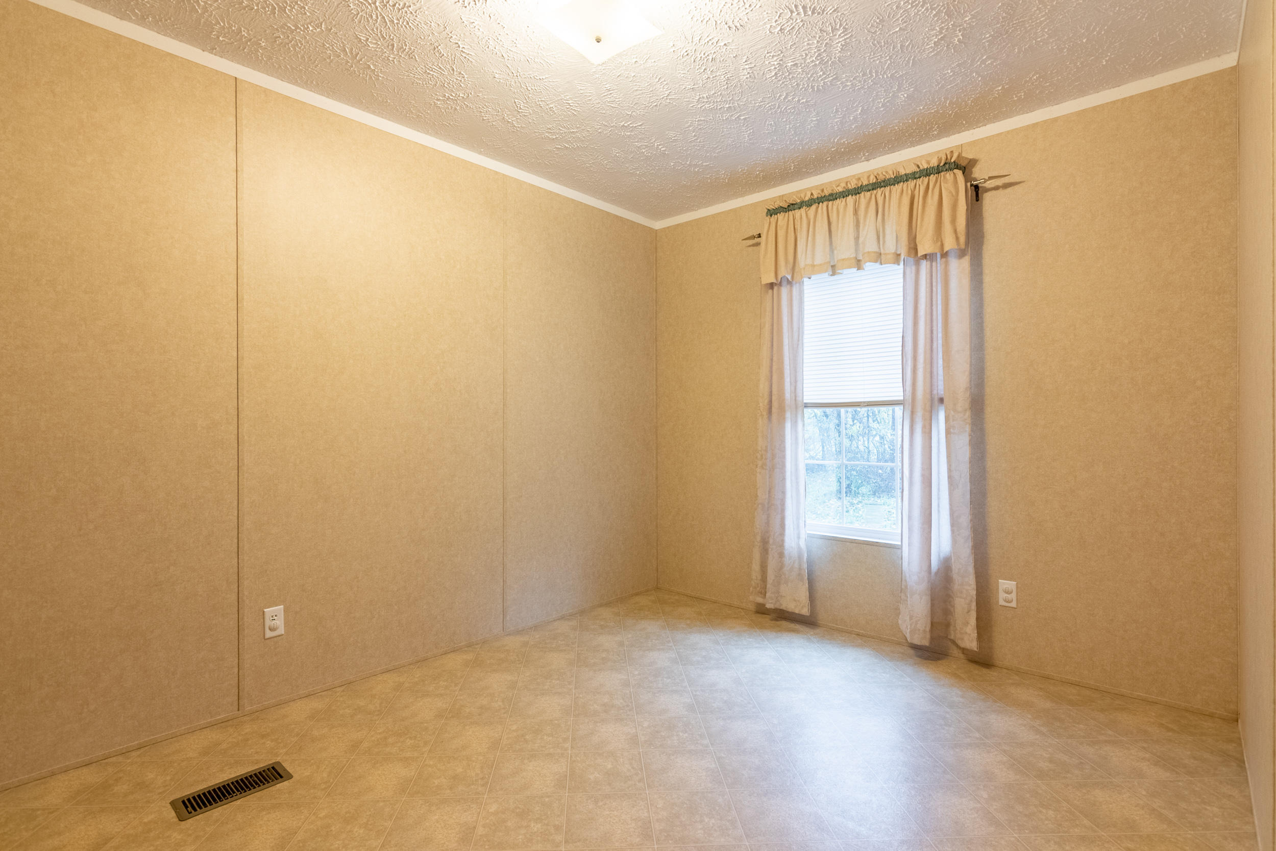 127 Millimeter Road Southwest Floyd, VA 24091 - Photo 14 of 31 an empty room with windows
